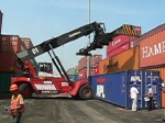 Crane moving a container